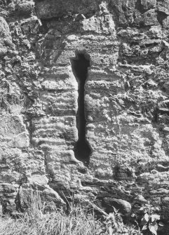Detail of inverted keyhole loop with crosslet in West wall.