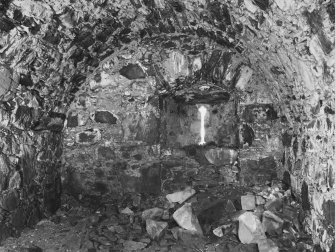 Interior.
General view of the central apartment, North limb, on ground floor showing gun embrasure in West wall.