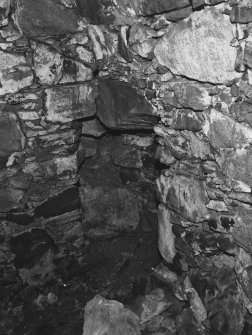 Interior.
Detail of corner recess in mural chamber in North-East angle of ground floor, North wing.