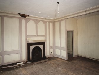 Interior.View of ground floor /North room dining room from South showing sideboard recess, fireplace and panelling