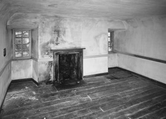 Interior. View of second floor North room from South showing coombed ceiling and fireplace