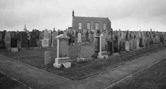 View from S showing setting in graveyard