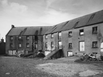 Detailed view from SE, showing rear (S side) of W end of mill range