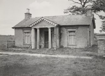 View of Bruxie Lodge in derelict condition, showing Doric portico