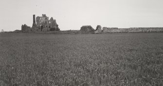 General view of castle and barmkin wall from West.