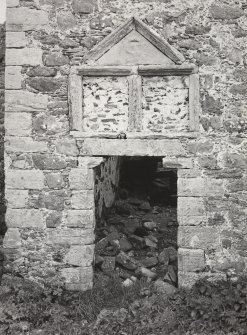 Detail of North wall of main tower, entrance doorway and surmounting panels.