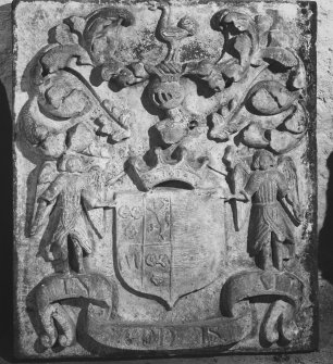 Detail of armorial panel, with sheild held by two angels, one side bearing the arms of Fraser of Philorth, the other blank.