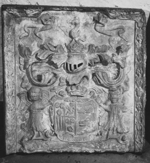 Detail of armorial panel, with sheild held by an angel and a gentleman, bearing the arms of Lord Alexander Saltoun and Lady Mary Gordon who were married in 1707.