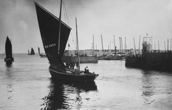 General view with fishing boats.
Insc: 'Peterhead Harbour 'Hoisting Sail'. 4012. G.W.W'.