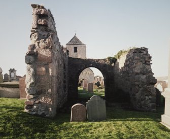 Remains of church with tower behind, view from east