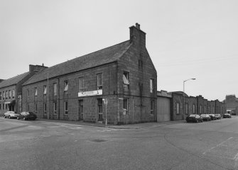 Peterhead, St Peter Street- Windmill Street, Bus depot
General view from south of bus station, showing bus company offices (left, Windmill Street), and south east side of depot (right, St Peter Street)