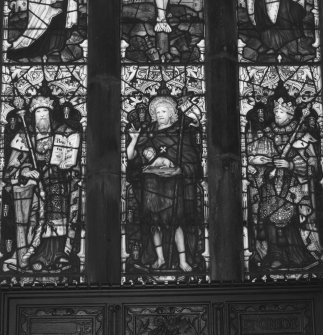 Interior. Detail of E stained glass window medieval tracery with stained glass by C E Kempe