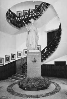 Interior.Town-house, ground floor, main stair hall, view of stair with statue of Queen victoria.