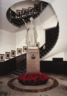 Interior. Town-house, ground floor, main stair hall, view of stair with statue of Queen victoria.