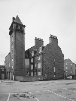 View from north east showing rear of main block, and hose-drying tower