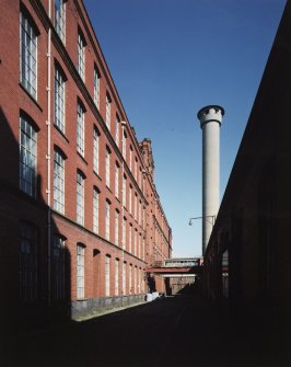 View from S along alley to concrete tower.