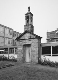 Entrance doorway and bellcote from 'Old Grammar School' now built into corridor linking main building to extensions at rear. View from NE