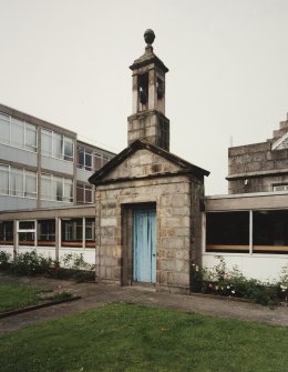 Entrance doorway and bellcote from 'Old Grammar School' now built into corridor linking main building to extensions at rear. View from NE