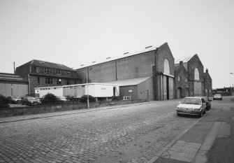 Aberdeen, York Place, Hall Russell Shipyard.
General view from West along York Street. On left is former office and apprentice training school, fabrication bays No.3, 3a, 4, 4a and the blacksmith's training school.