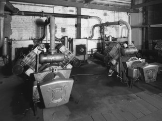 Aberdeen, York Place, Hall Russell Shipyard.
View in compressor room, located on the East side of No.4 bay of platers' sheds. (3 Bellis Morcom Typr BM 42 'V' - block air compressors - WP 100 PSIG. Partially in view on left is one of two air receivers, 1.2 diameter, and 2.7m long).