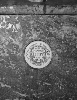Interior. Detail of typical Doulton (of Lambeth, London, and Paisley) nameplate, several of which survive on the stall urinals