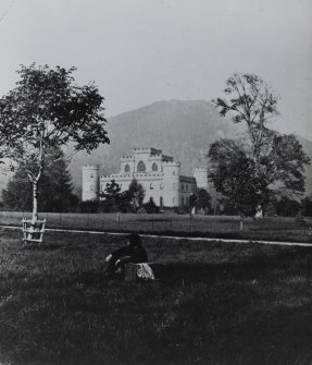 Inveraray Castle.
General view with a gentleman reclining on a picnic hamper.