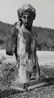 Inveraray Castle, garden.
View of the torso of a Classical male nude on a plinth.