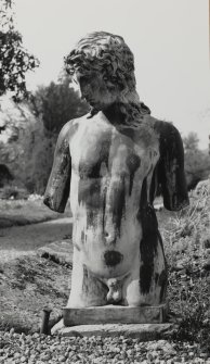 Inveraray Castle, garden.
View of the torso of a Classical male nude on a plinth.