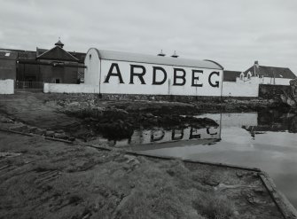 Ardbeg Distillery
View from S of S (seaward) side of distillery, showing bonded warehouse bearing the name 'ARDBEG' in large letters, designed to catch the eye of passing ferry passengers