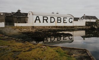 Ardbeg Distillery
View from S of S (seaward) side of distillery, showing bonded warehouse bearing the name 'ARDBEG' in large letters, designed to catch the eye of passing ferry passengers