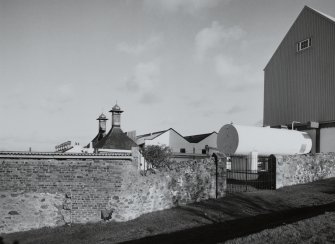 Bowmore Distillery
View from W showing the roofs of the two kilns, and the gables of the neighbouring floor maltings
