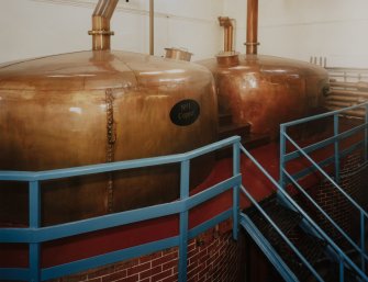 Bowmore Distillery
Interior view within mash house showing copper hot water tanks