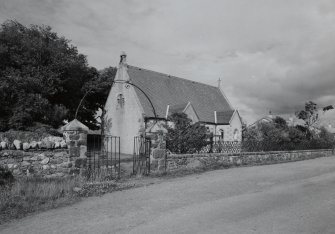 View from SSW showing stting with walls, railings and gates