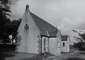 View from SW showing bellcote and projecting  S porch and organ chamber