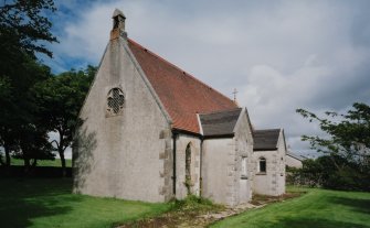 View from SW showing bellcote and projecting S porch and organ chamber