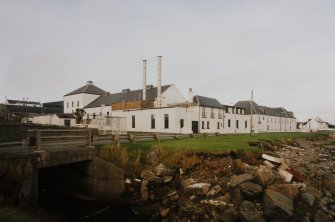 Islay, Bruichladdich Distillery
General view of distillery from SE after it became 'silent' in the mid-1990s.  In order to prevent irreversible decay, a small batch of whisky is made every year to keep the plant in working order