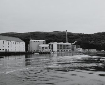 Islay, Caol Ila Distillery.
View from SE (from sea) of still house and other production buildings forming the N part of the distillery complex