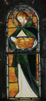 Interior, detail of stained glass window depicting the communion bread