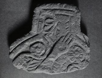 Fragment of cross-head, Kilchoman Parish Church.
View of fragment, obverse (KG 18)