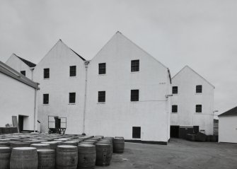 Lagavulin Distillery
View from W of W side of bonded warehouses, with barrels in yard (foreground)