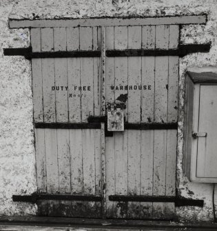 Lochindaal Distillery, Port Charlotte.
Detail of bonded warehouse, specimen strap-hinge door with 'shrouded' hasp-lock.