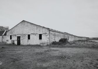 Islay, Port Ellen Distillery
View from SW showing seaward side of the S block of bonded warehouses, situated at the E end of the distillery