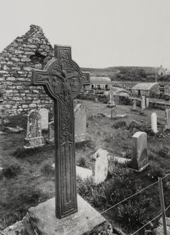 General view, with chapel in background, of MacMillan's Cross, Kilmory Knap Chapel.