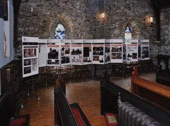 View of World of Worship exhibition panels in nave