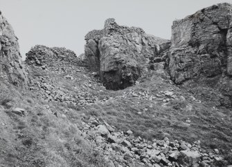 View of upper and lower curtain walls at West end of gully.