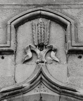 Detail of carved panel above door.