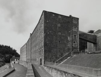 Oblique view from SE showing SW side of Mill No.3, with Mill No.2 in the background, and the bridge to the Institute (right)