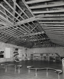 Interior. View from NW in top floor, converted into exhibition space, showing wooden roof trusses