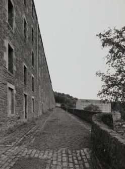 Oblique view from W along SW side of Double Row, with Mill No.1 visible in background (right)