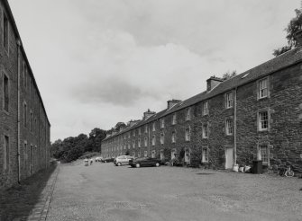 General view from SE along Rosedale Street, with S side of Long Row (right), and Double Row (left)